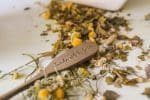 yellow and white flower petals on white ceramic container